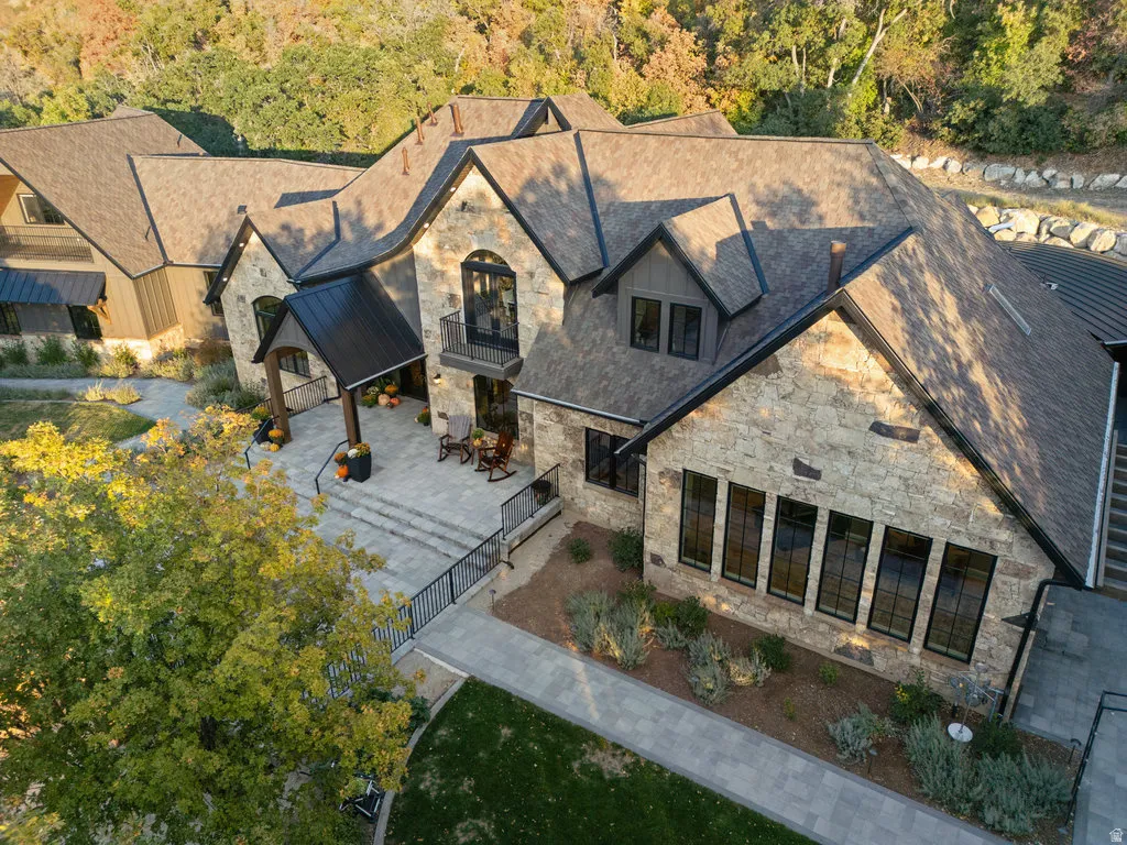 Stone-clad exterior featuring multiple gables and dormer windows