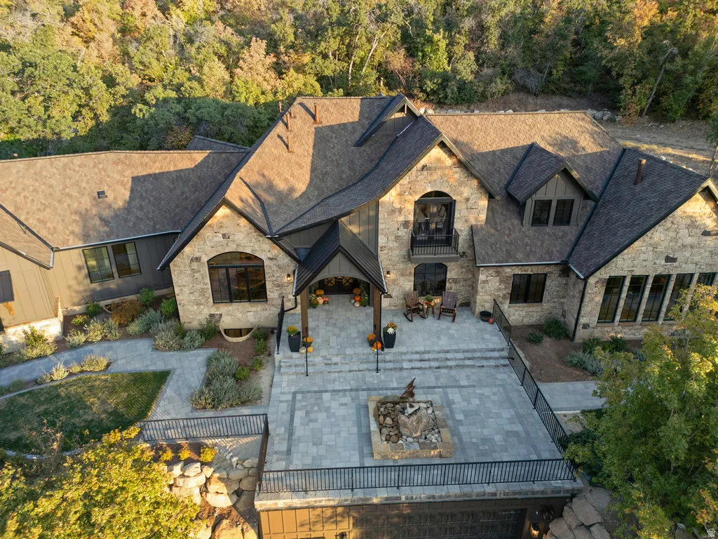 Stone and siding exterior with dark trim accents