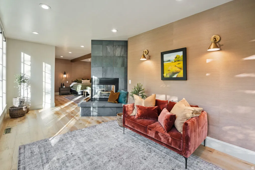 cozy fireplace with a stone surround and hearth