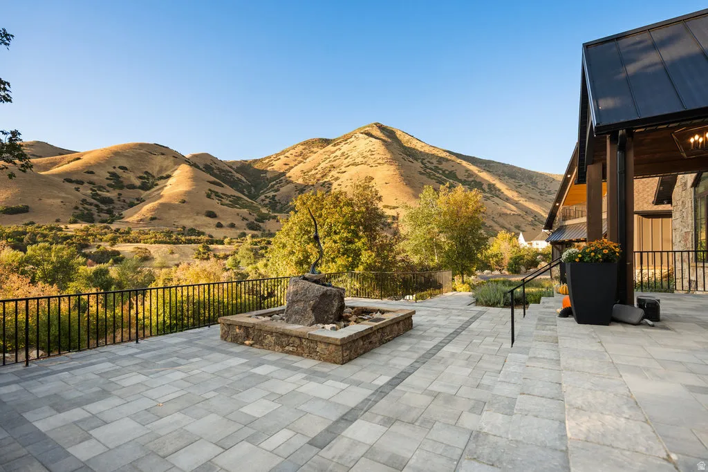 Expansive paver patio with a decorative water feature