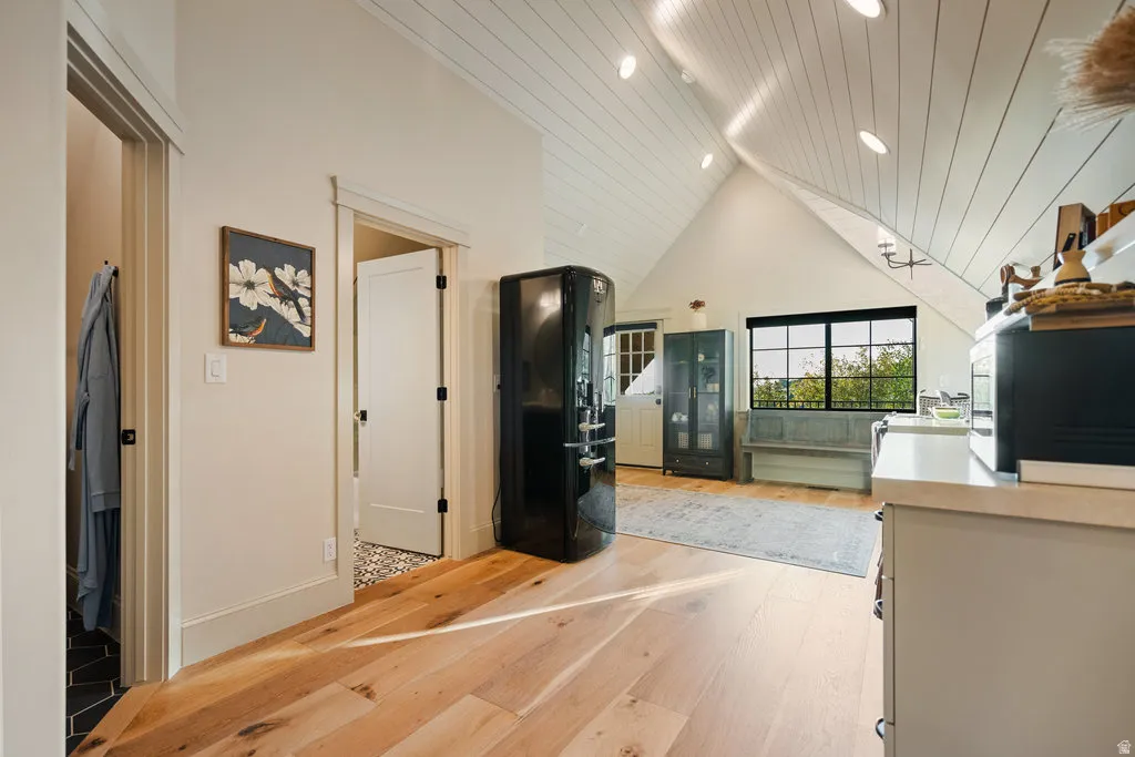 Vaulted shiplap ceiling with recessed lighting