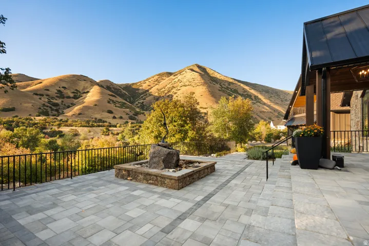Expansive paver patio with a decorative water feature
