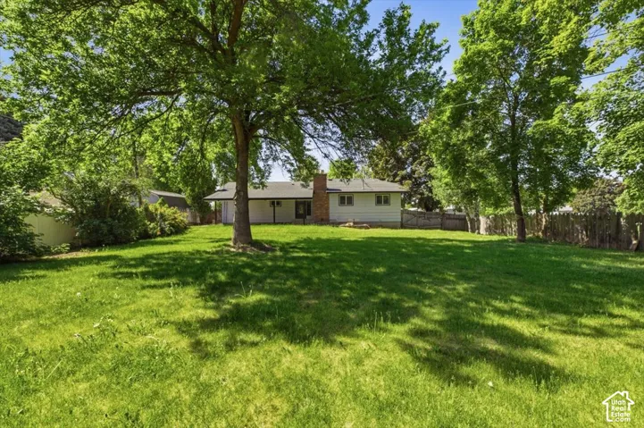 Spacious backyard featuring extensive green lawn