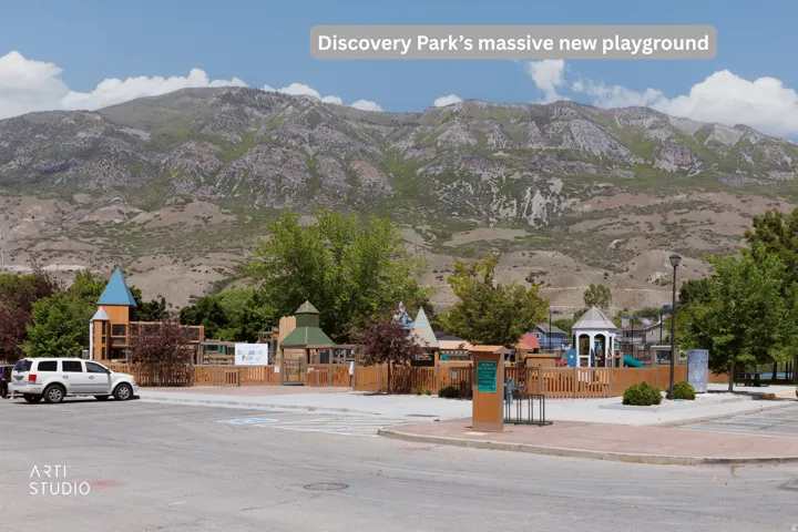 Expansive community park featuring a multi-level playground structure, a distinct gazebo, and mature trees