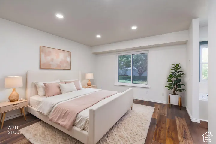 Bedroom featuring rich wood-finish flooring and recessed lighting