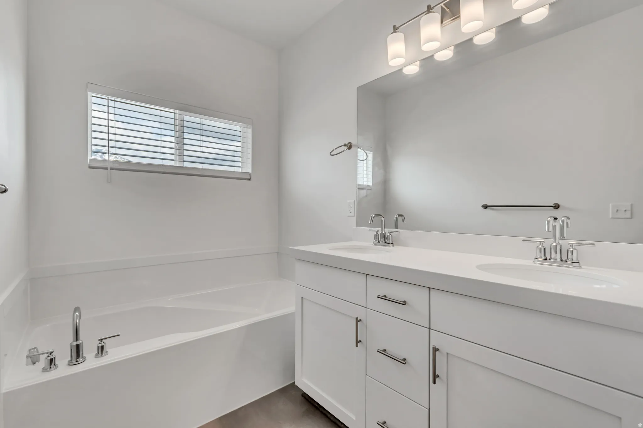 Dual vanity with undermount sinks and white countertops