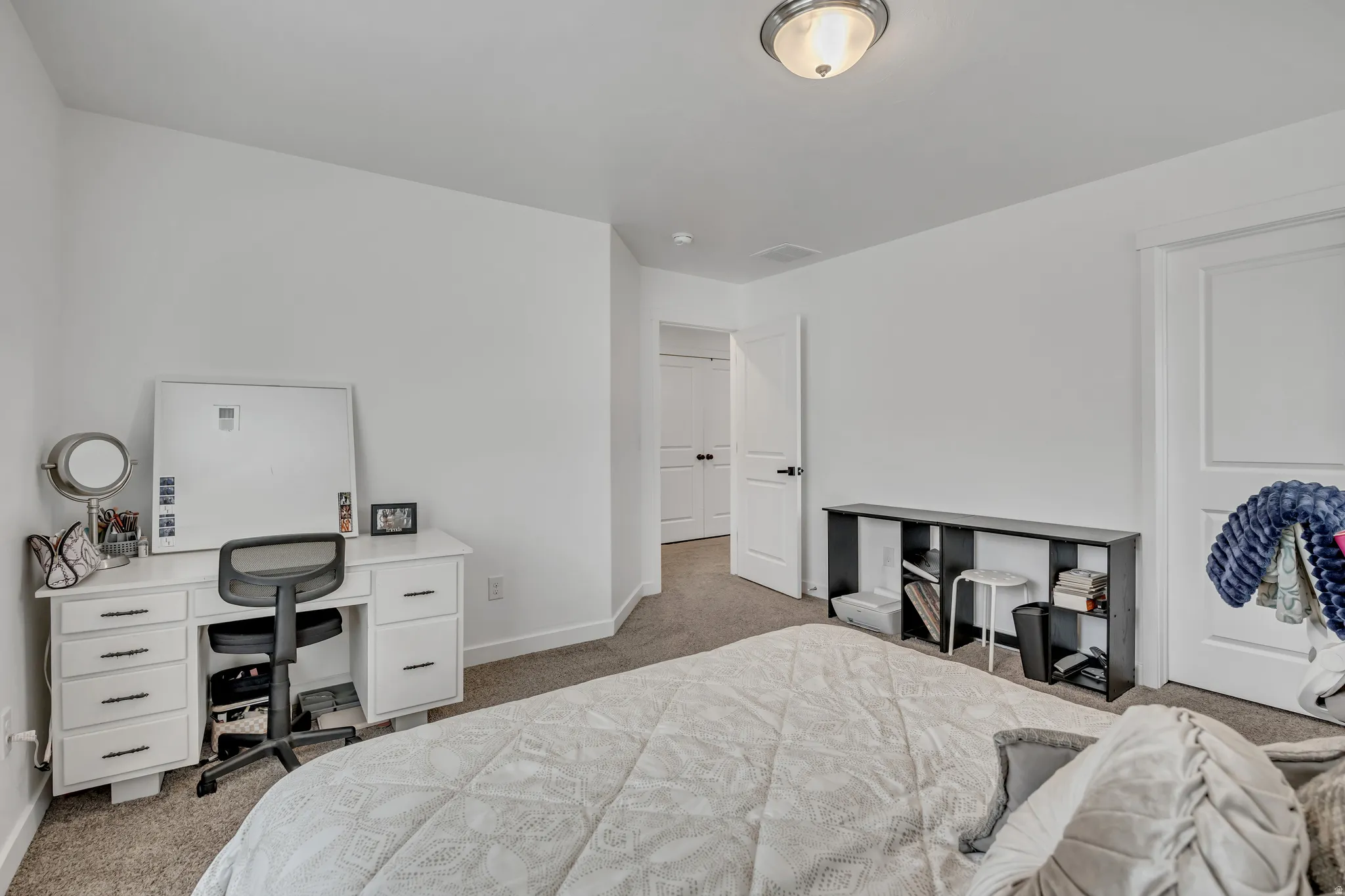 Room featuring light-colored walls and carpet flooring