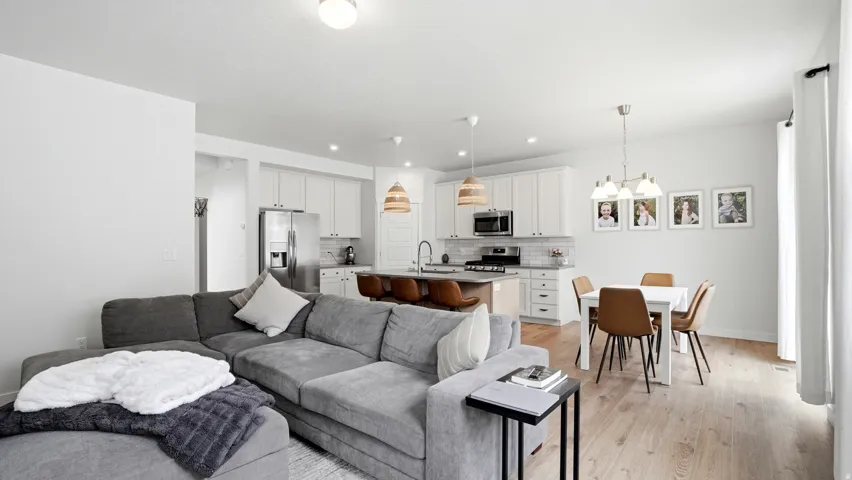 Open-concept living area featuring light wood-finish flooring throughout