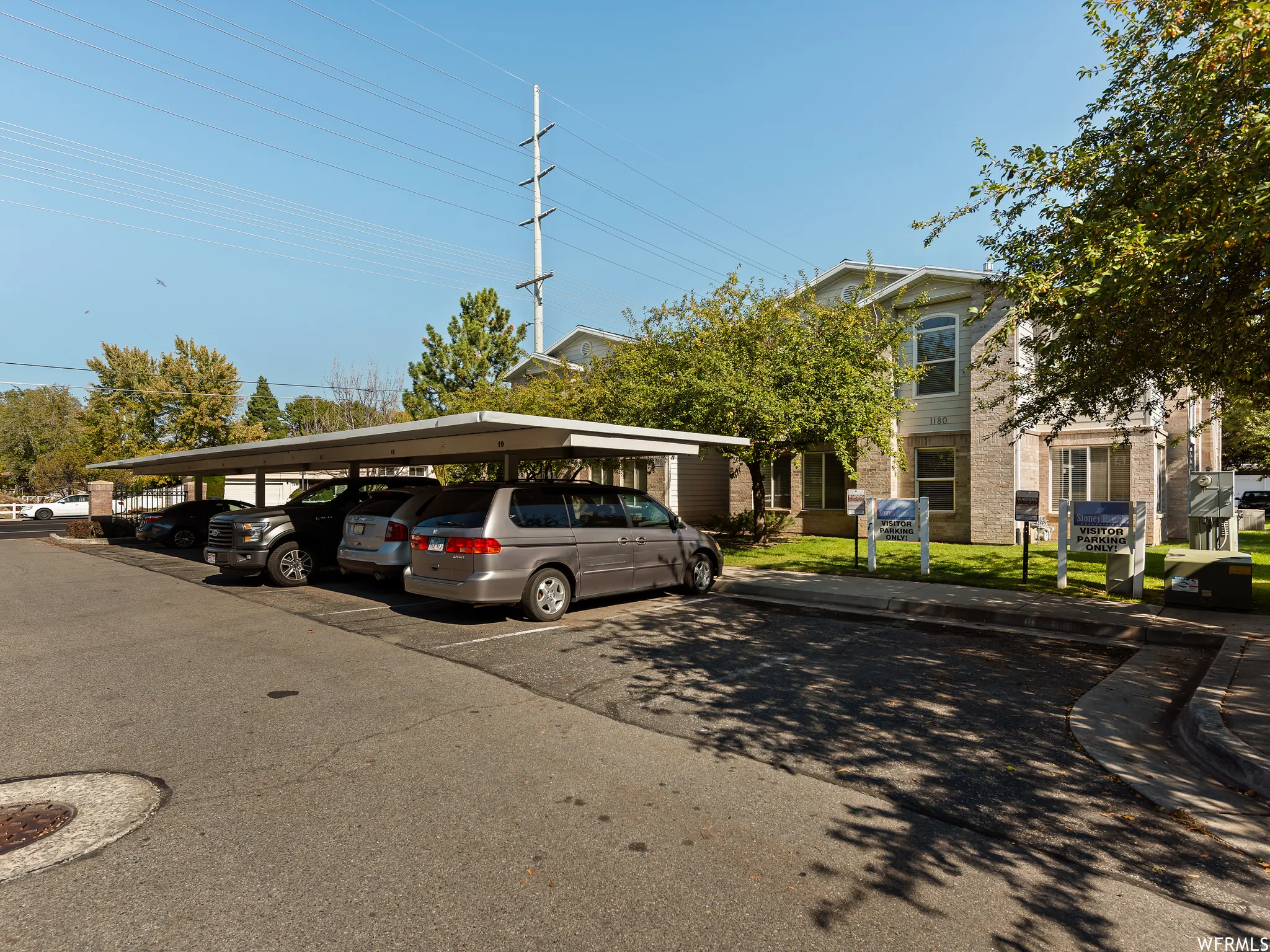 Exterior facade with light-colored brick veneer and siding accents