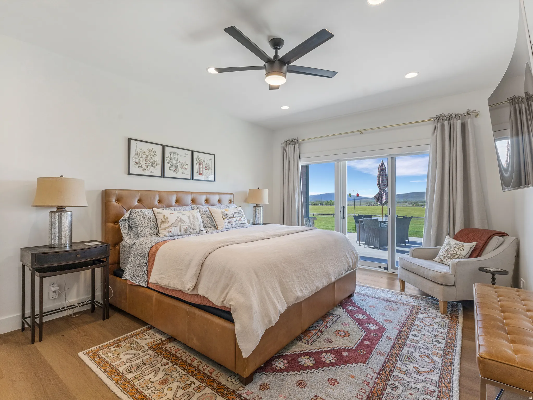 Bedroom featuring a vaulted ceiling with a ceiling fan, light wood-finish flooring, and recessed lighting