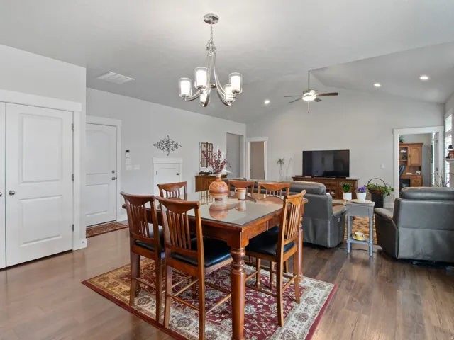 Open-concept living area featuring wood-finish flooring throughout