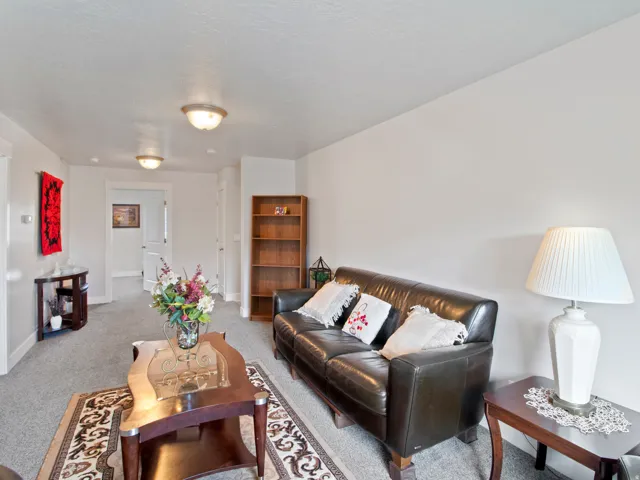 Neutral wall tones complement the ceiling lighting fixtures