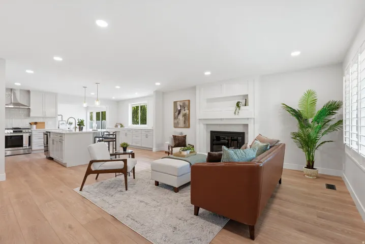 Open-concept living space featuring wood-finish flooring throughout