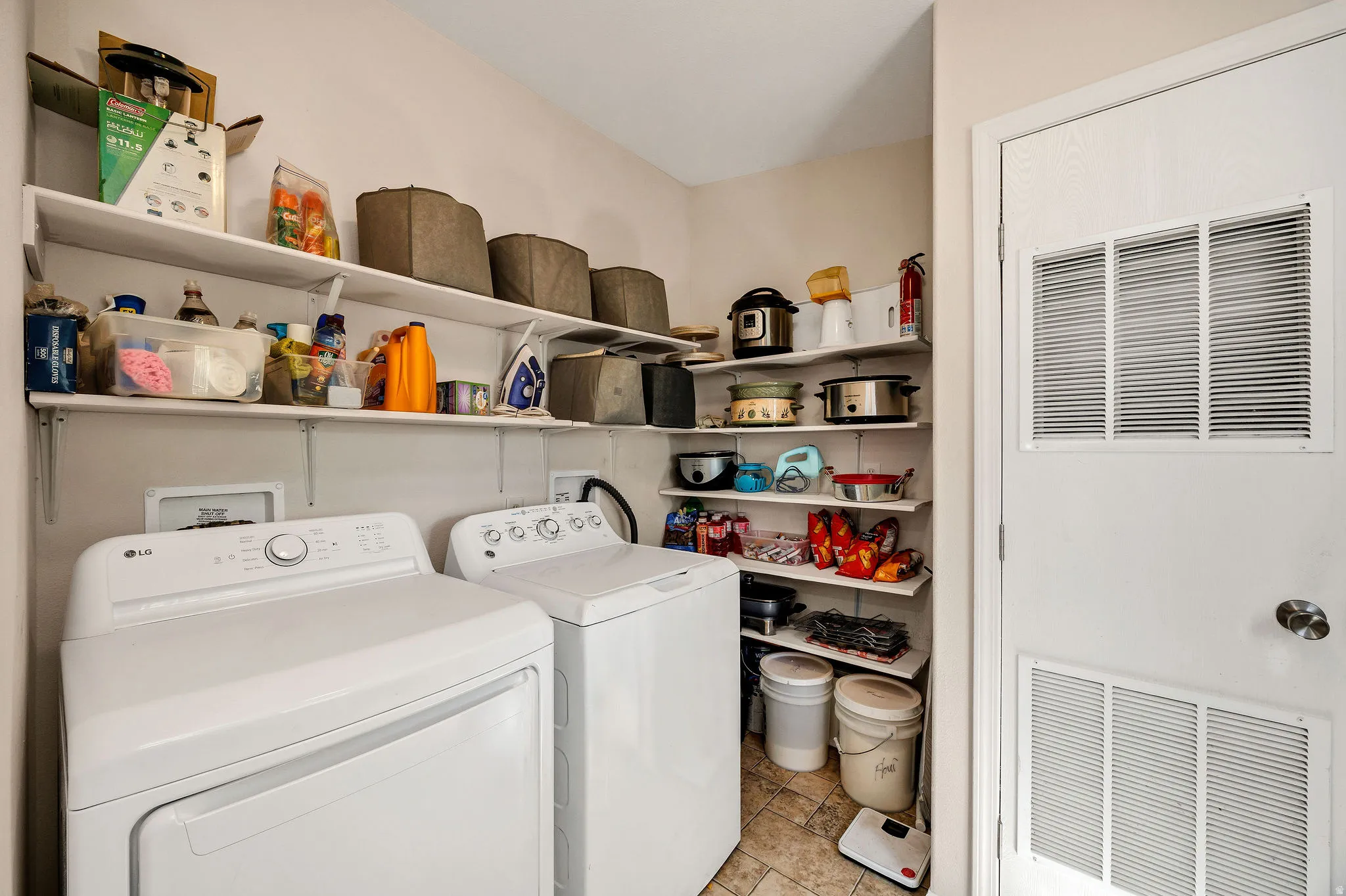 Dedicated laundry area featuring a washer and dryer