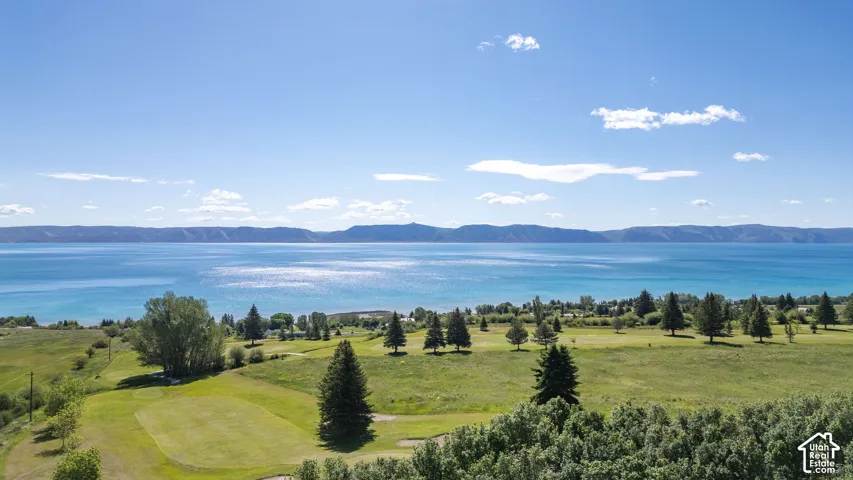 Expansive body of water with a distinct blue hue, framed by distant mountains