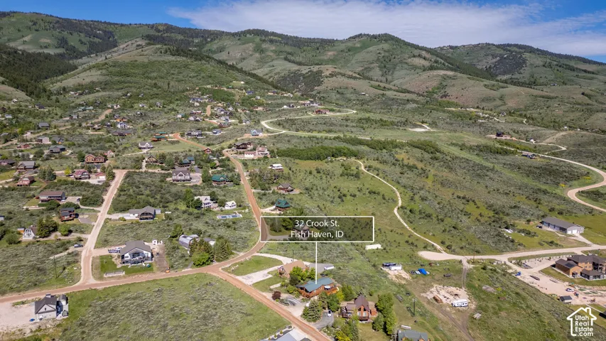 Expansive mountain landscape with scattered residential properties