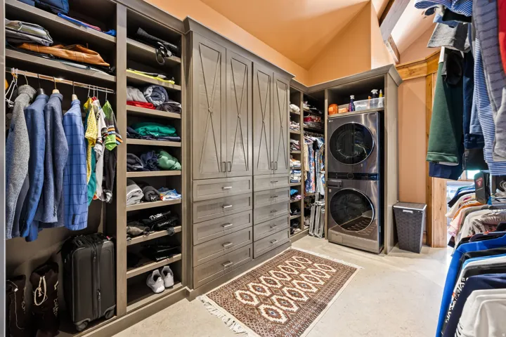 Built-in custom cabinetry system with integrated drawers and hanging storage