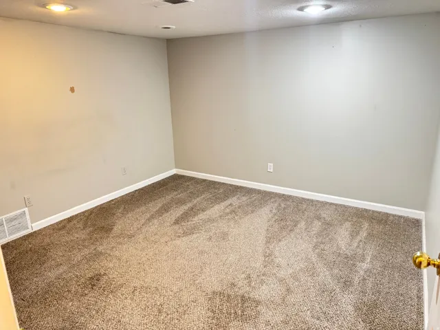 Carpeted room featuring light gray walls, recessed lighting, white baseboards, and a white ceiling