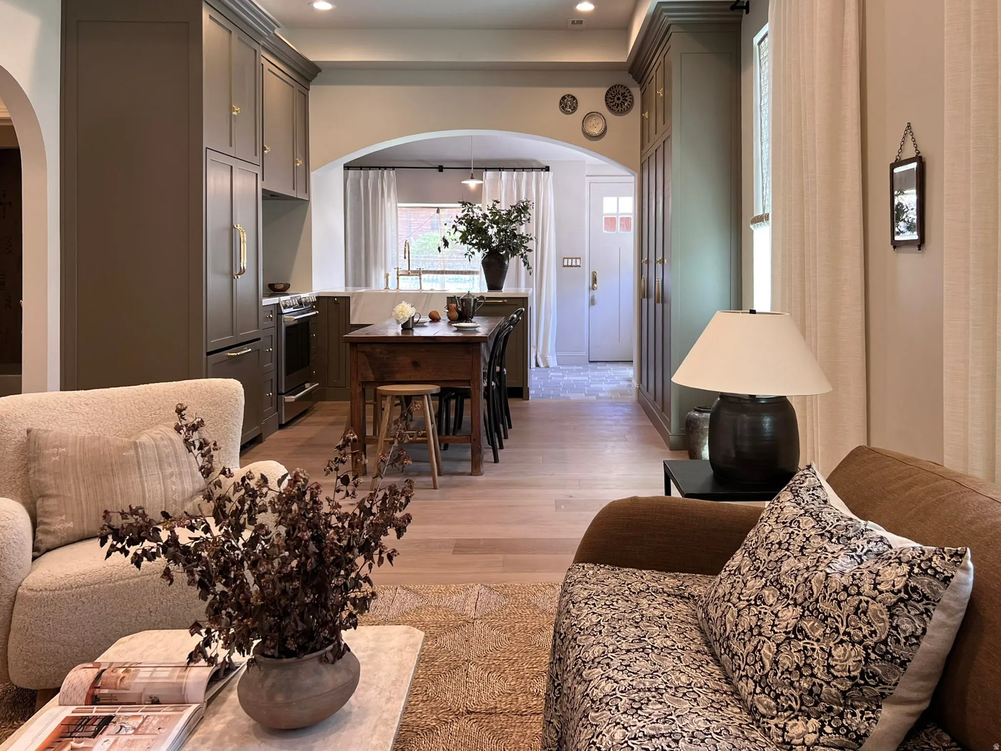 Open-concept living space featuring wood-finish flooring