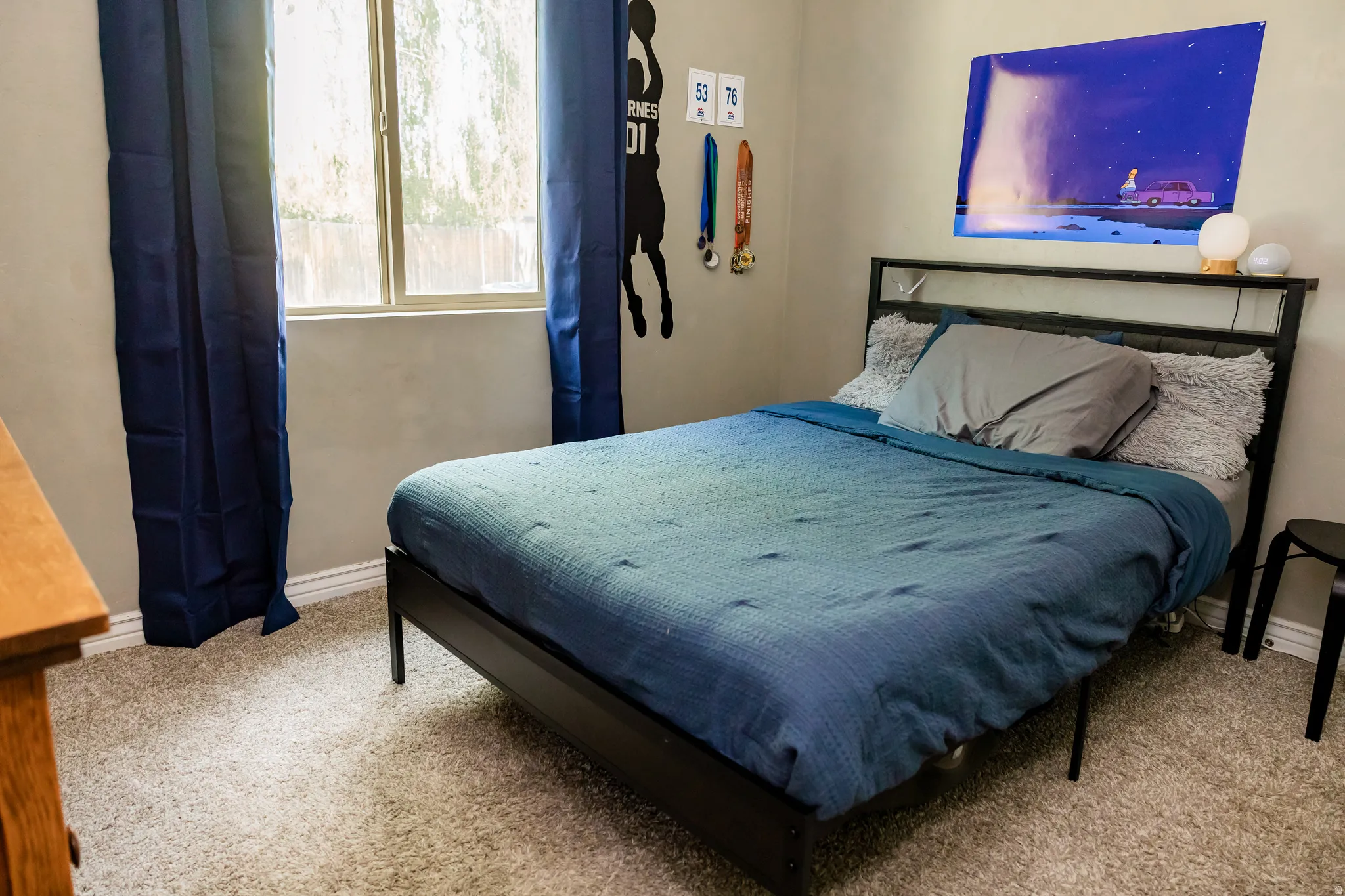 Carpeted room featuring a double-pane window, neutral wall paint, and white baseboards