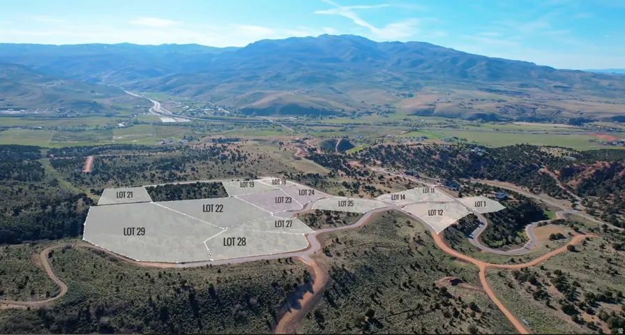 Aerial perspective showcasing multiple land lots within a developing community