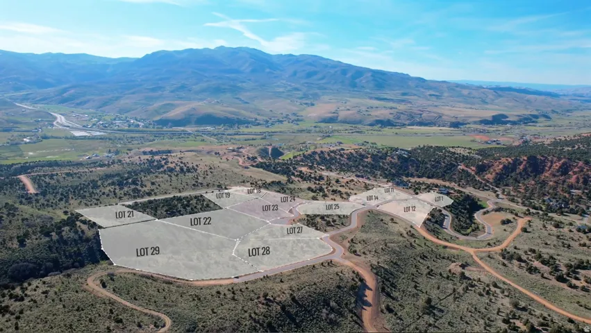 Aerial perspective showcasing multiple graded building lots with surrounding natural terrain