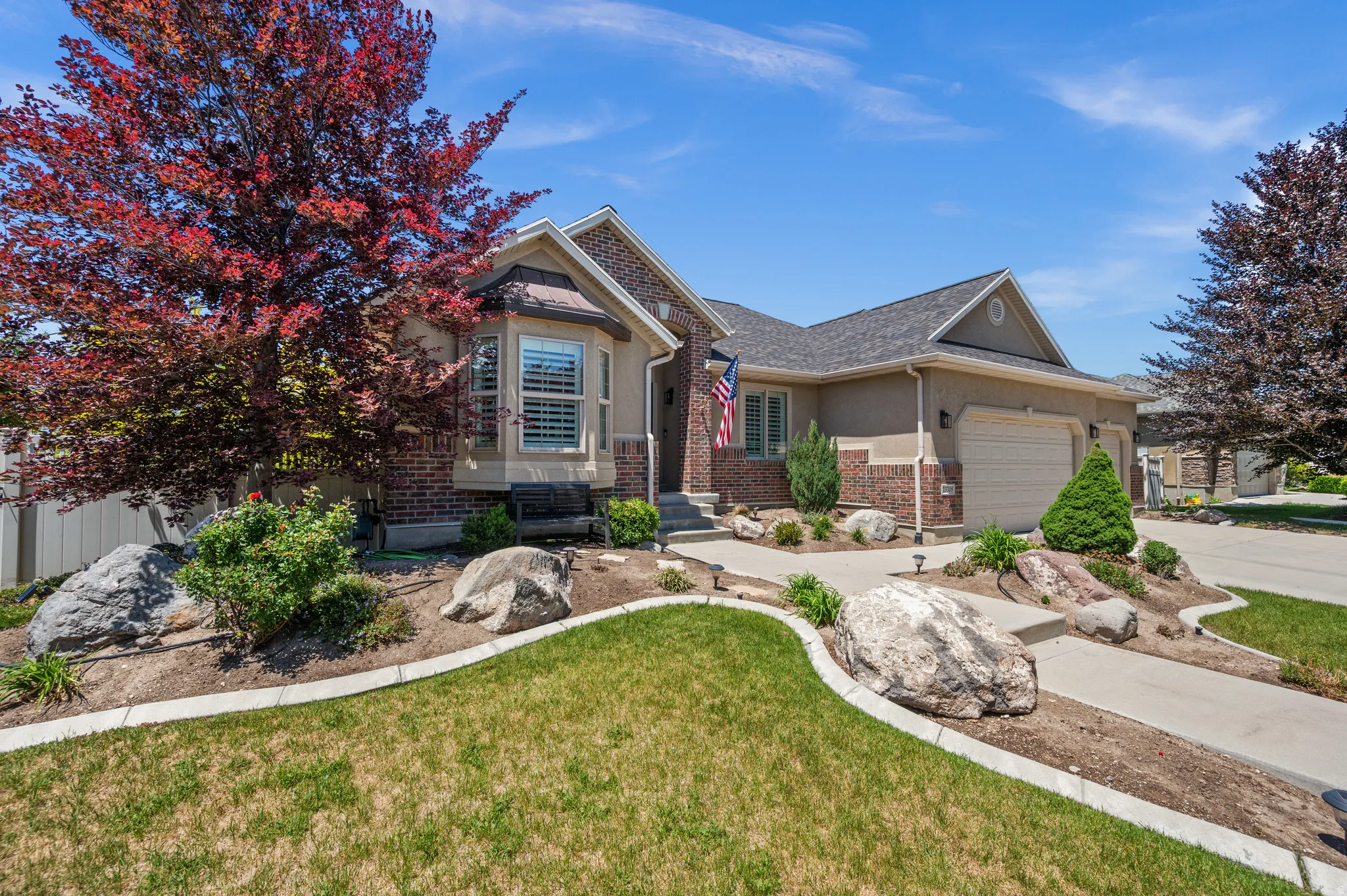 Property exterior featuring brick and stucco finishes