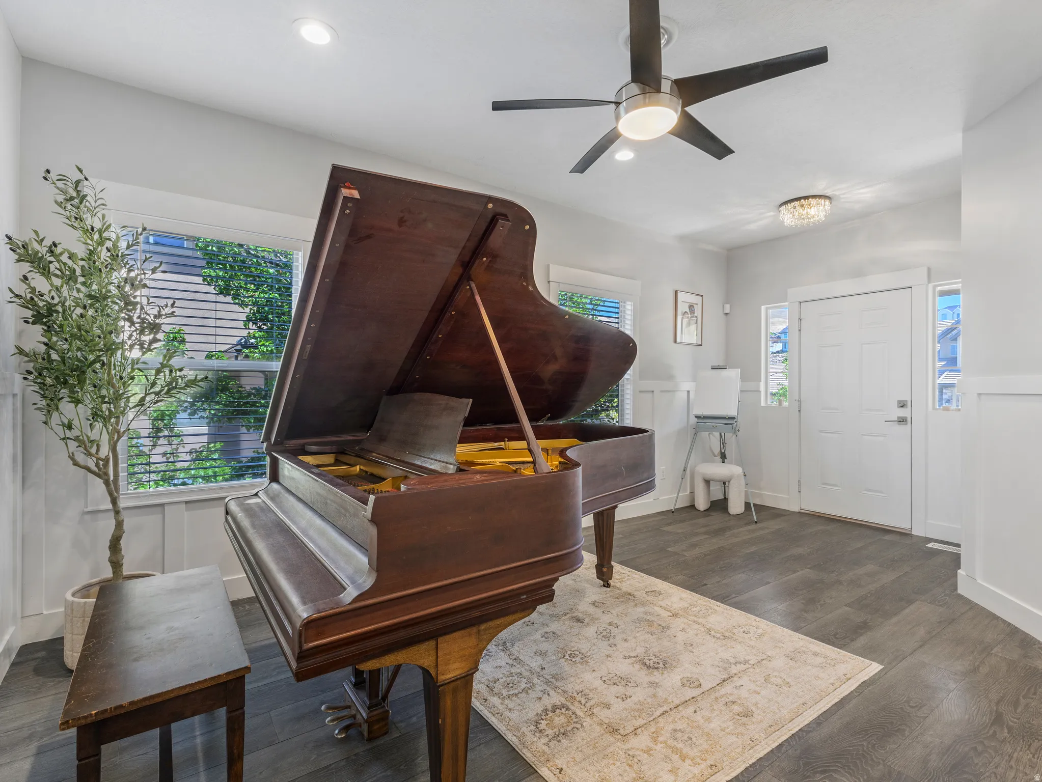 Entryway featuring wood-finish flooring, white paneled wainscoting, recessed lighting, and a modern ceiling fan