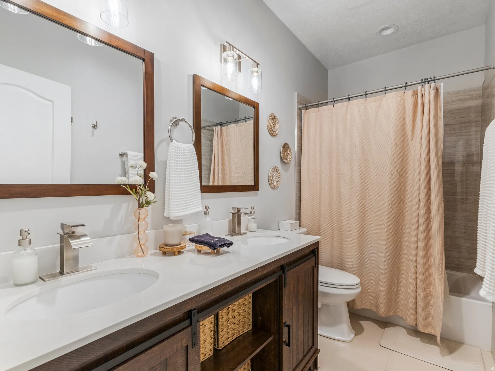 Dual vanity with white undermount sinks and white countertops