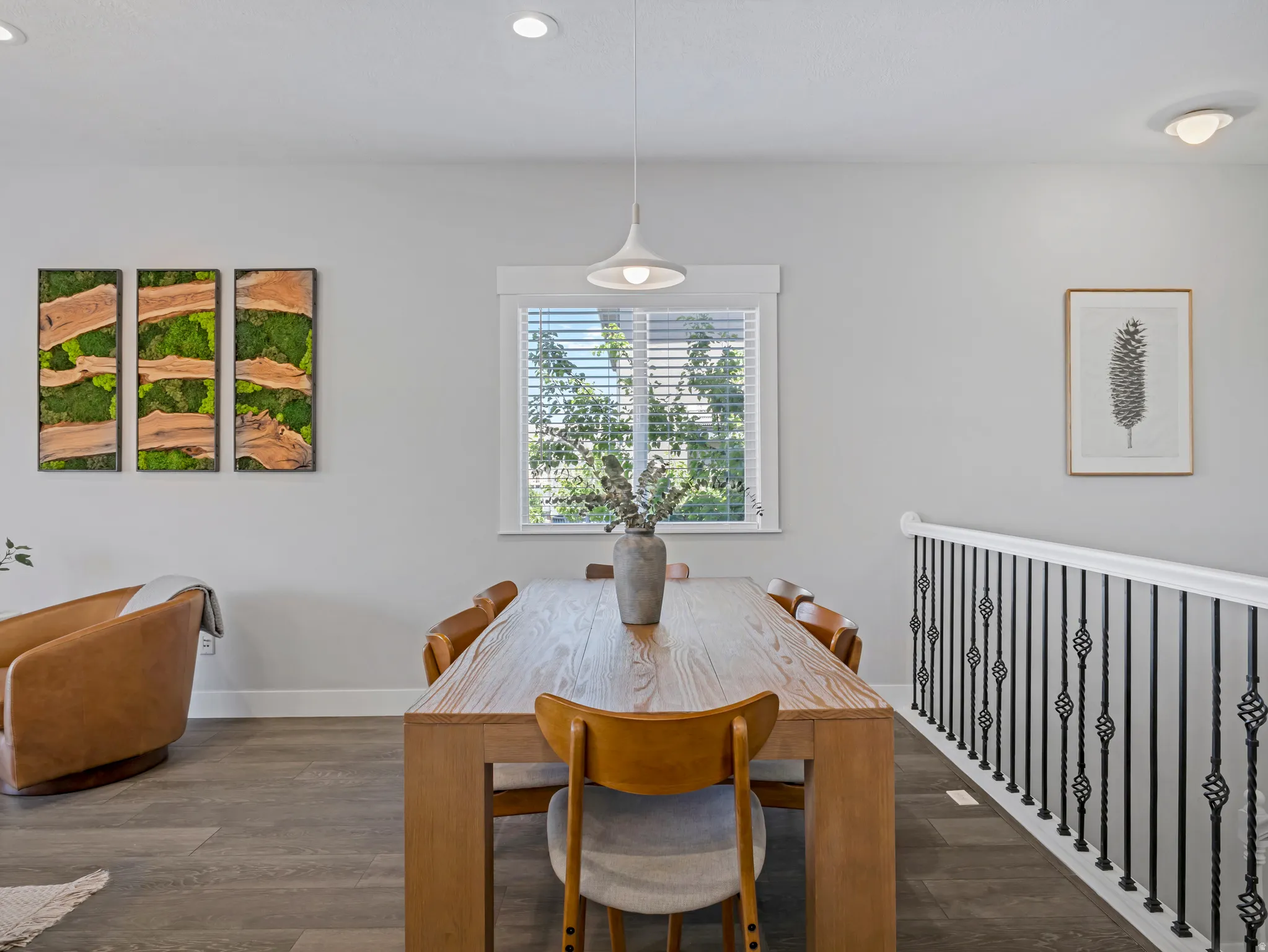 Dining area featuring wood-finish flooring and recessed lighting