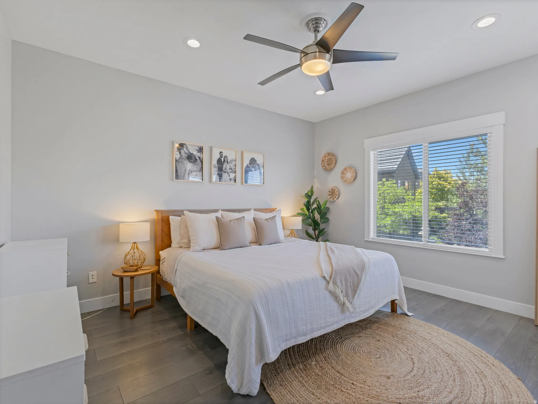 Bedroom featuring wood-finish flooring, recessed lighting, and a ceiling fan with integrated light fixture