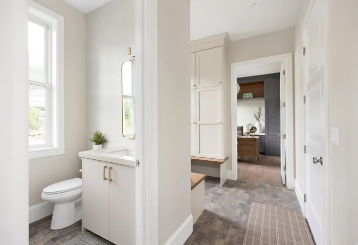 Mudroom entry featuring built-in cabinetry and bench seating