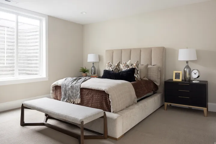 Carpeted bedroom featuring an egress window, recessed lighting, and neutral wall tones