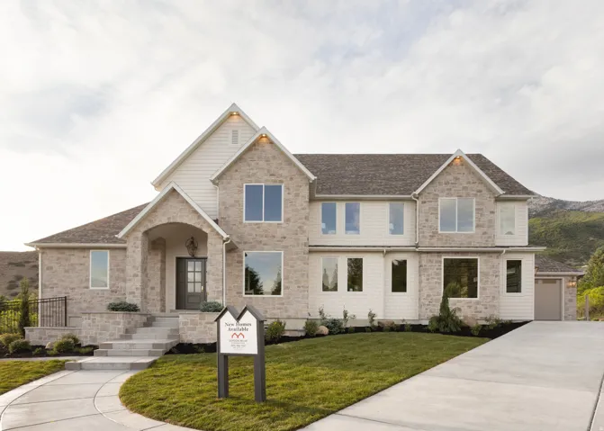 Stone and siding exterior with a multi-gabled roofline