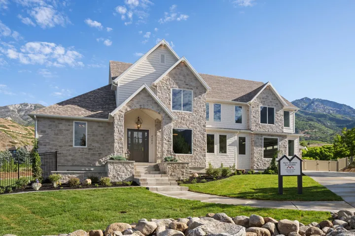 Stone and siding exterior with gabled roof lines