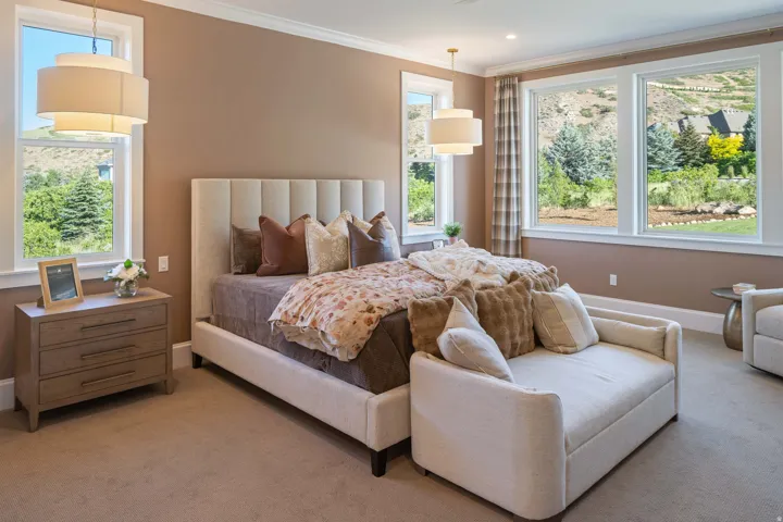 Neutral-toned bedroom with extensive natural light