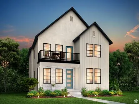 Modern farmhouse exterior featuring board and batten siding, white brick accents, a second-story balcony with black railing, and a teal entry door