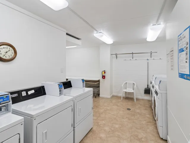 Dedicated laundry facility featuring multiple washing machines and dryers. Uses credit cards