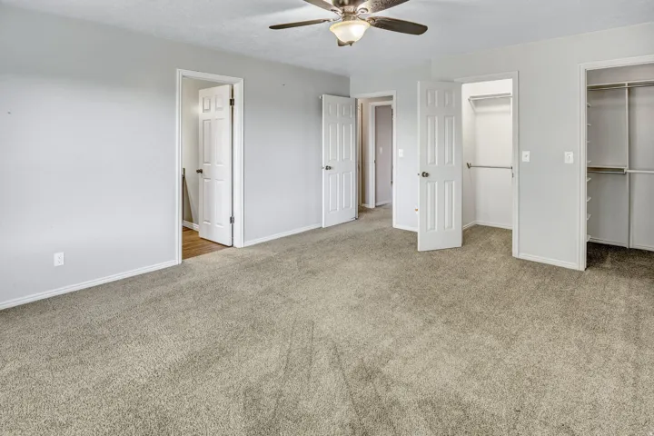 Spacious room featuring neutral carpet and light gray walls