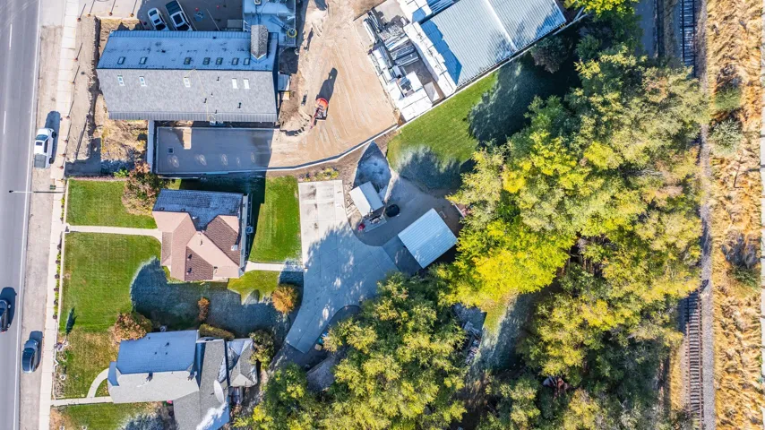 Aerial perspective showcasing a residential property with surrounding features