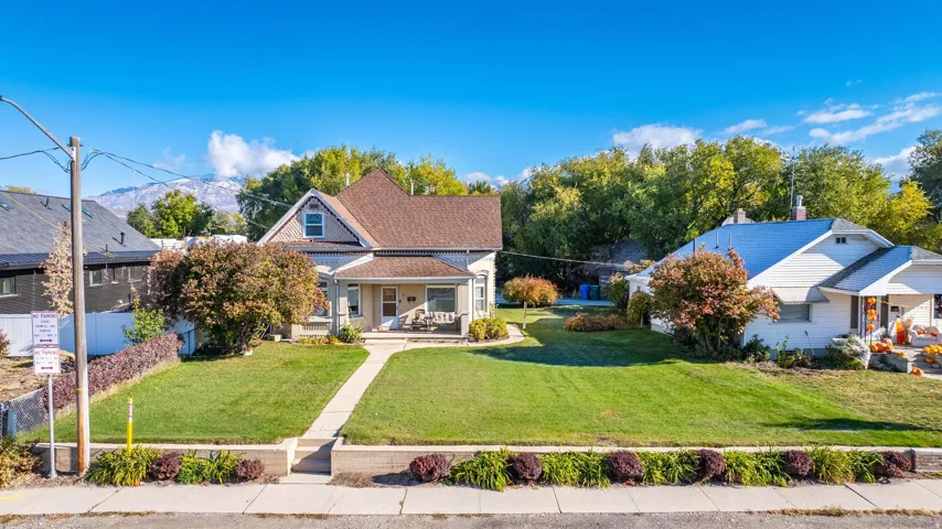 Charming property featuring a gabled roofline and a welcoming covered porch
