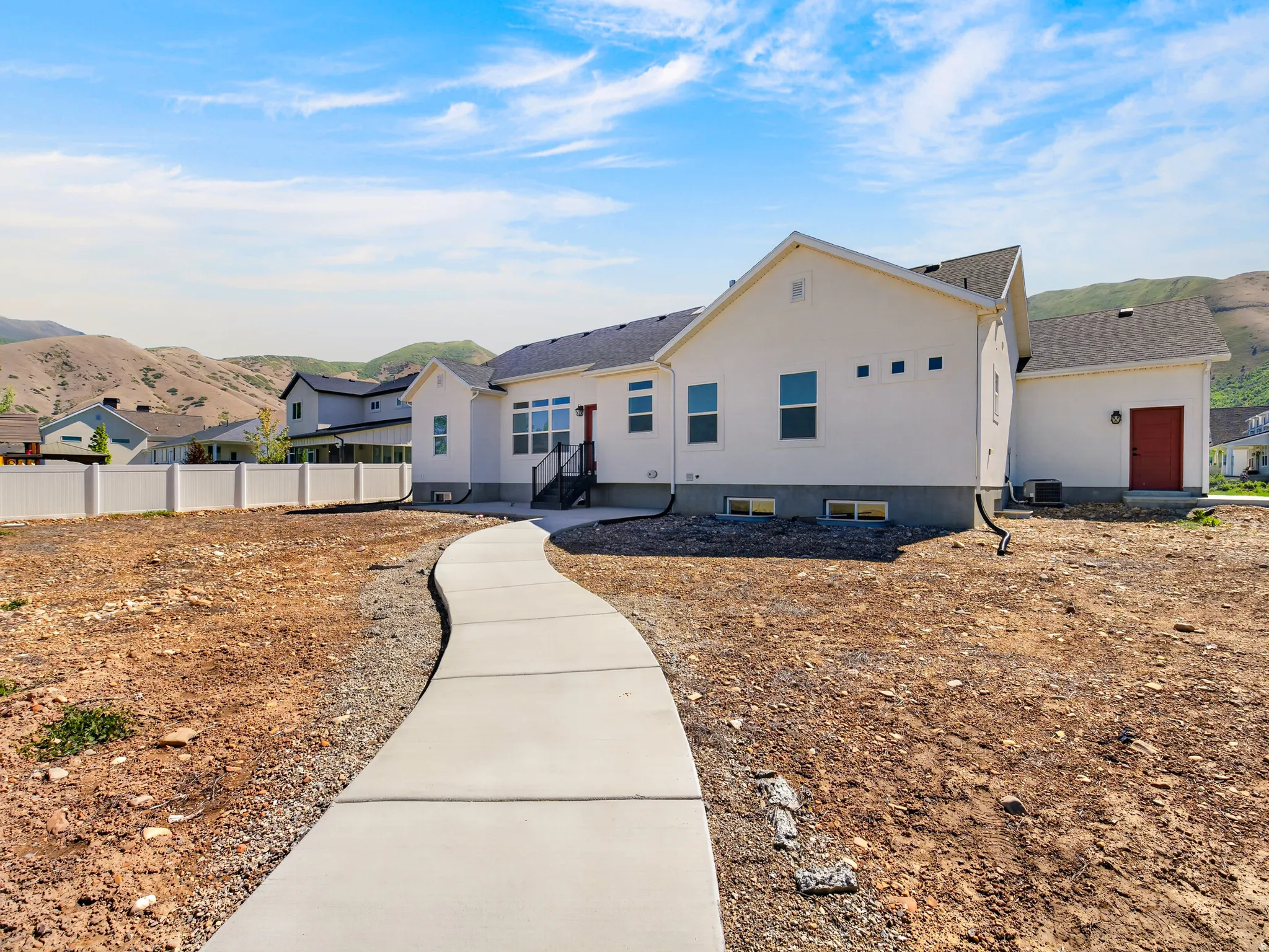 Rear of home with paved pathway