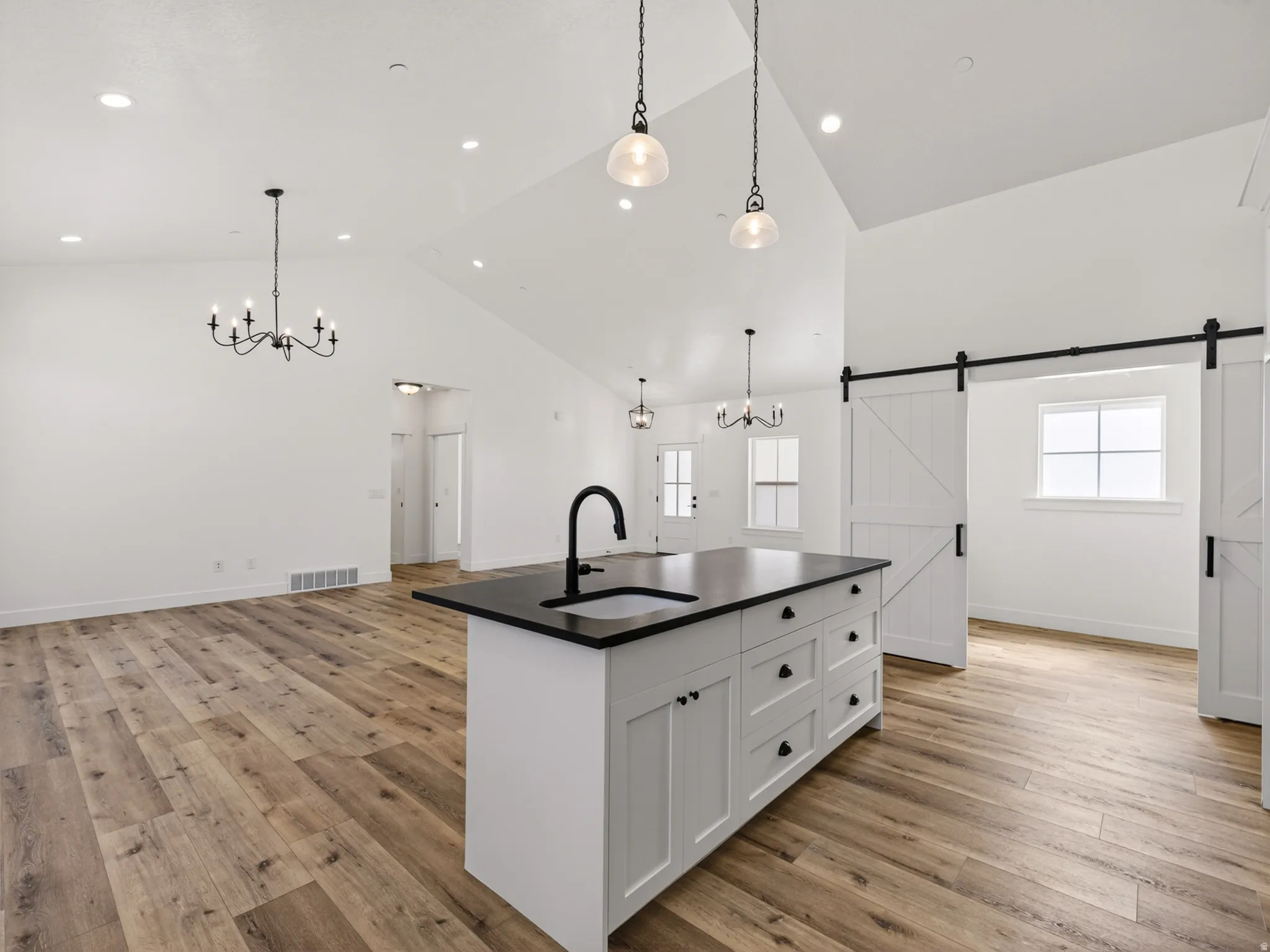 Vaulted ceilings with abundant recessed lighting