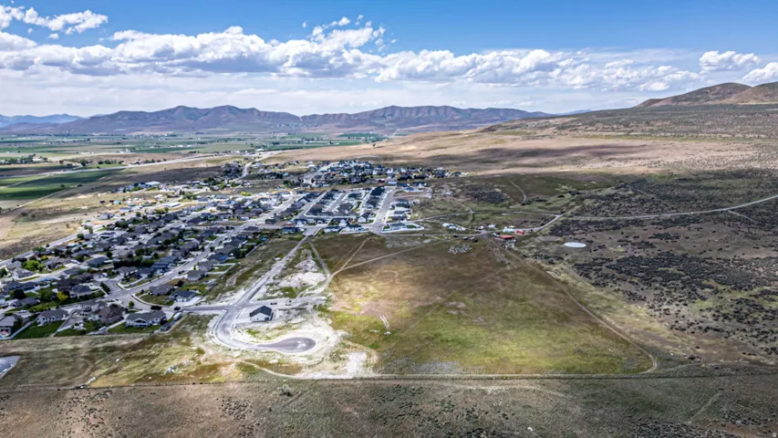 Aerial perspective showcasing a residential community within a broad valley setting
