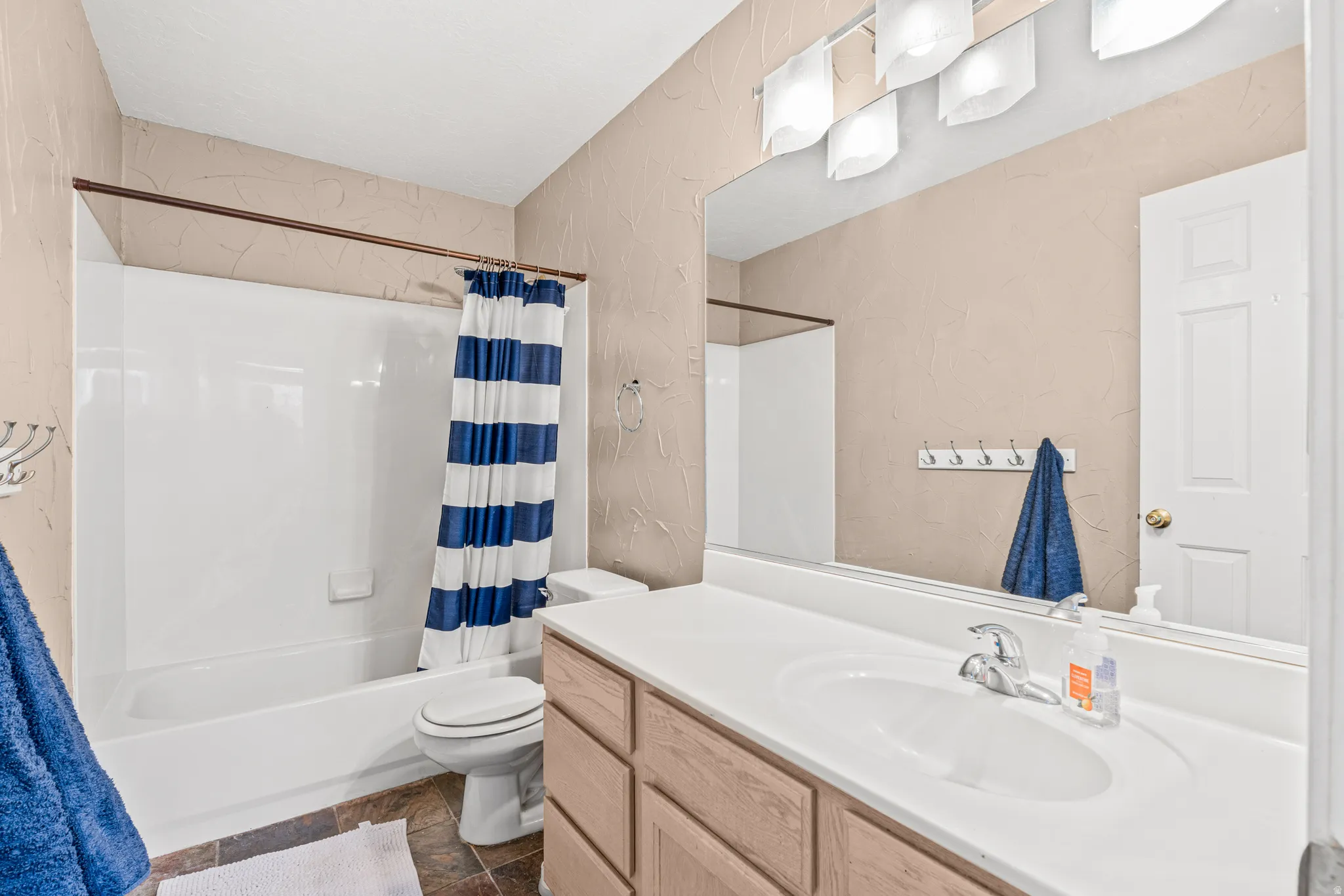 White tub and shower combination with a single handle faucet