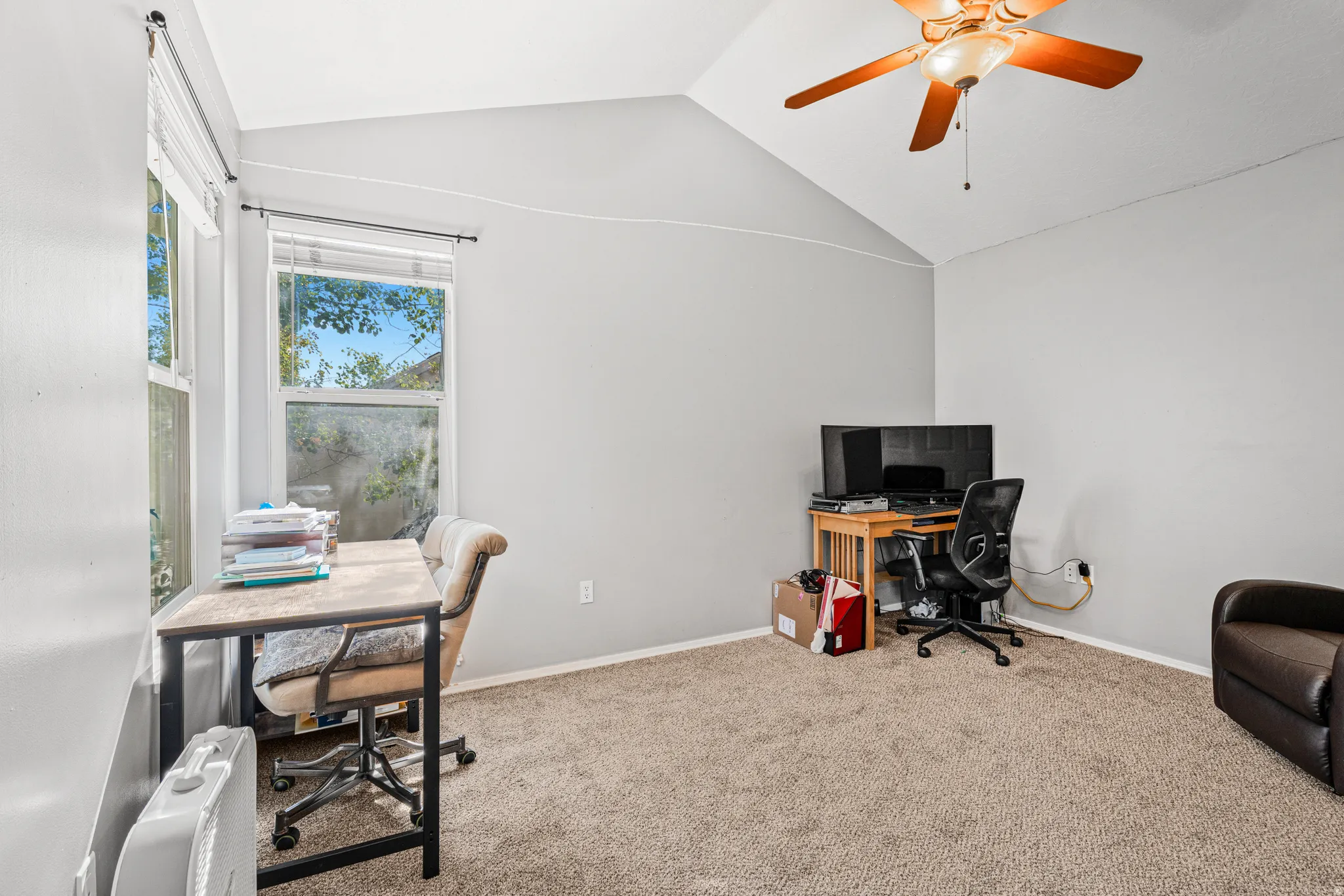 Vaulted ceiling with an attached ceiling fan