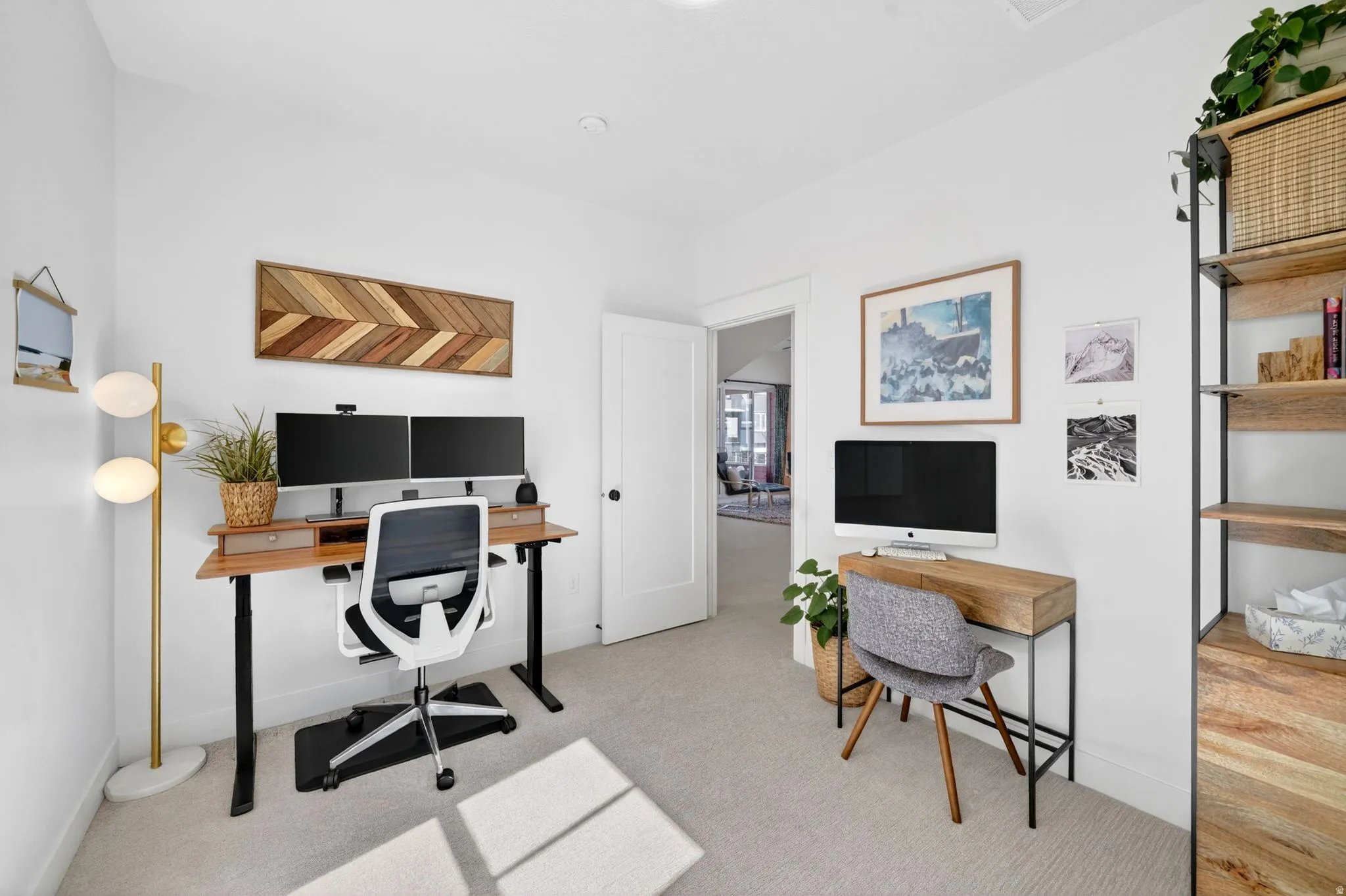 Bright interior space with light-toned carpet flooring and white walls