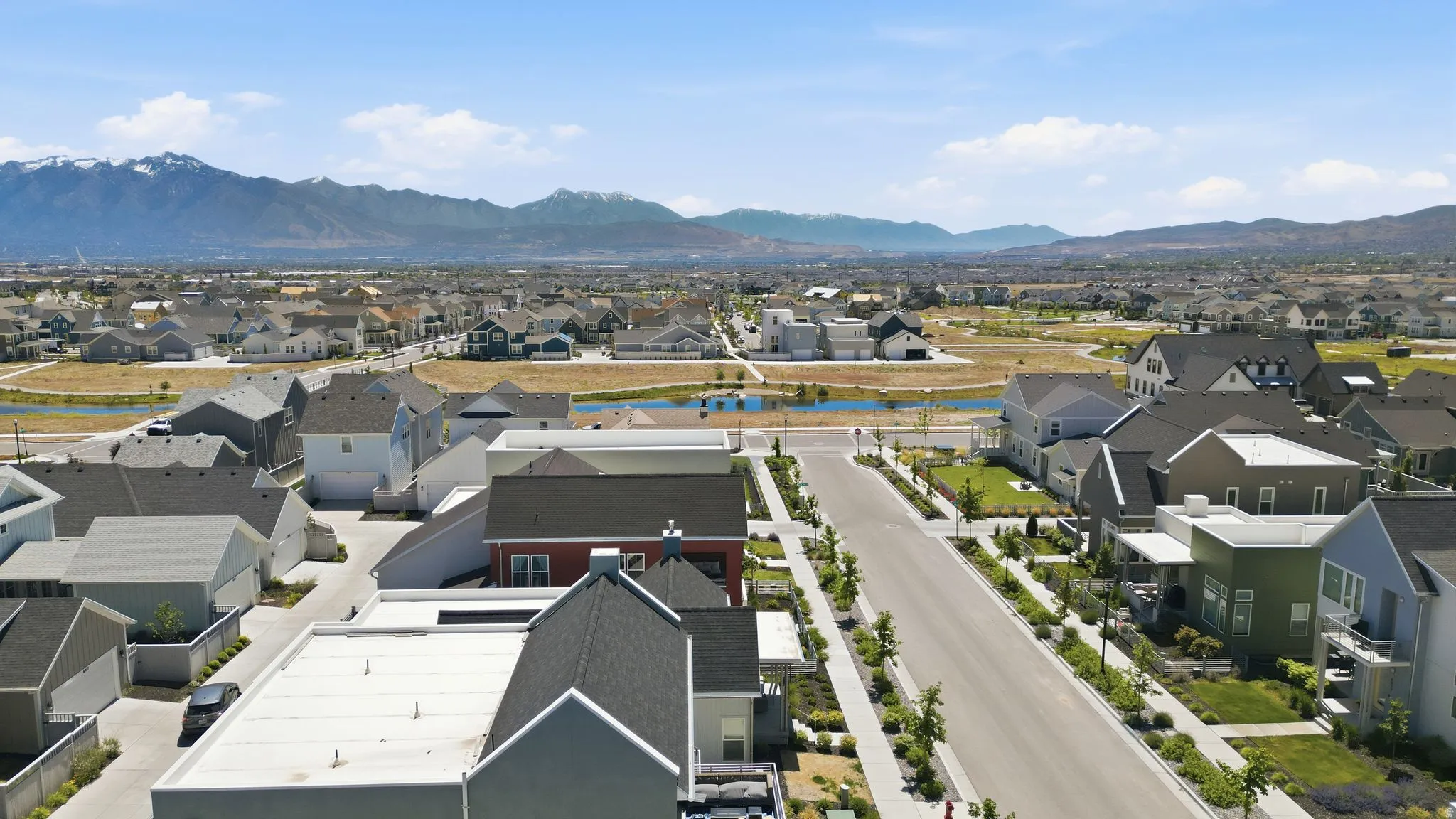Aerial perspective of a developed neighborhood featuring diverse residential architecture