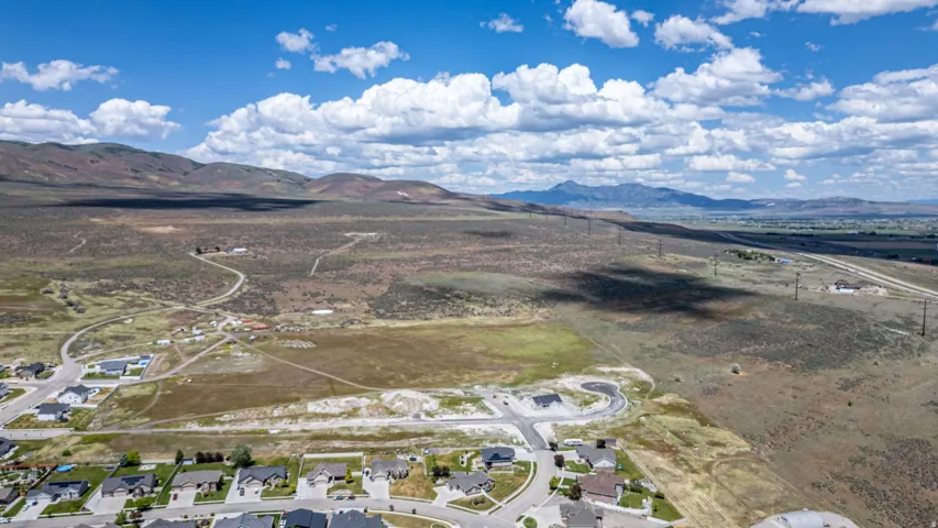 Expansive undeveloped land with a distant mountain backdrop