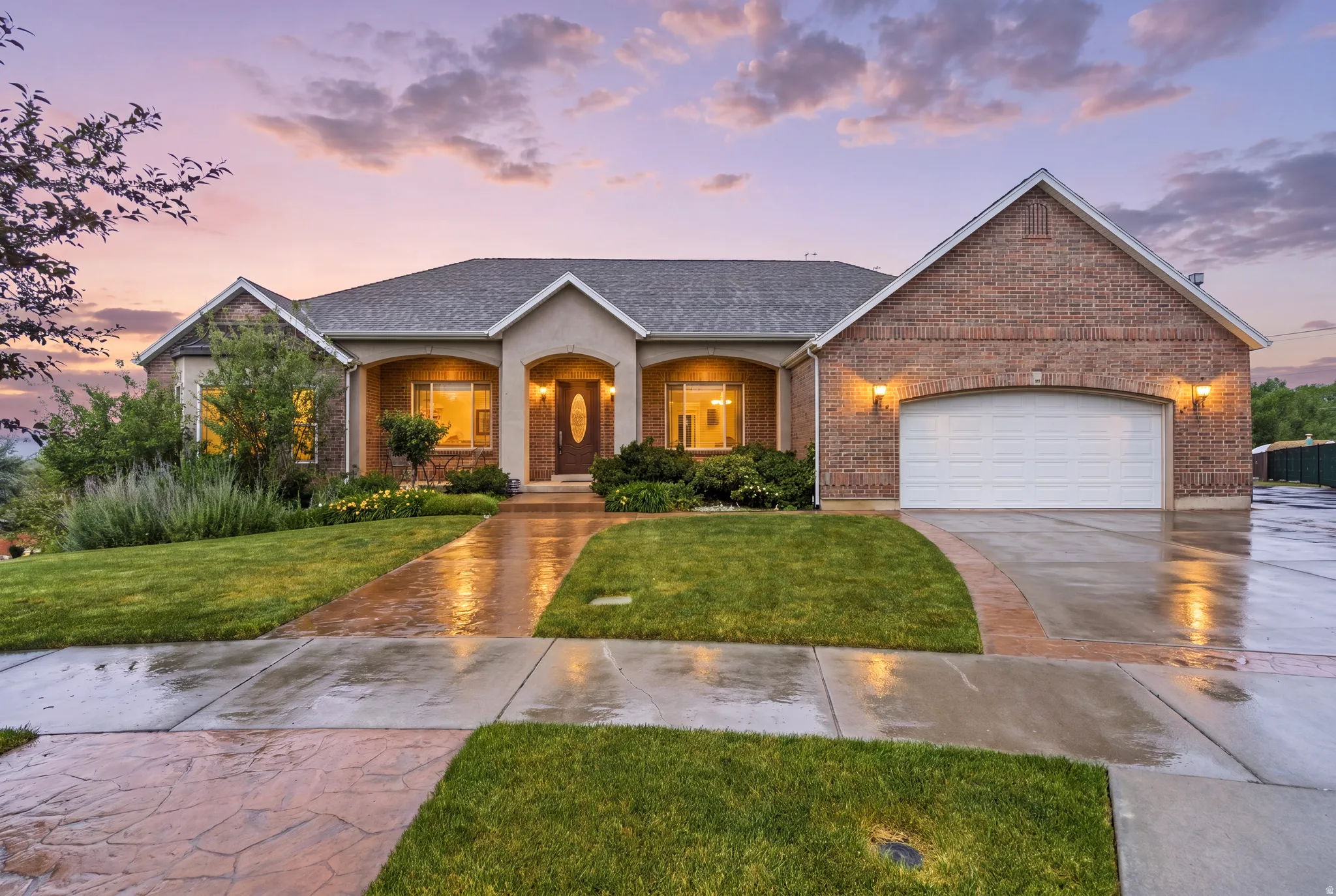 Brick and stucco exterior with an arched entryway